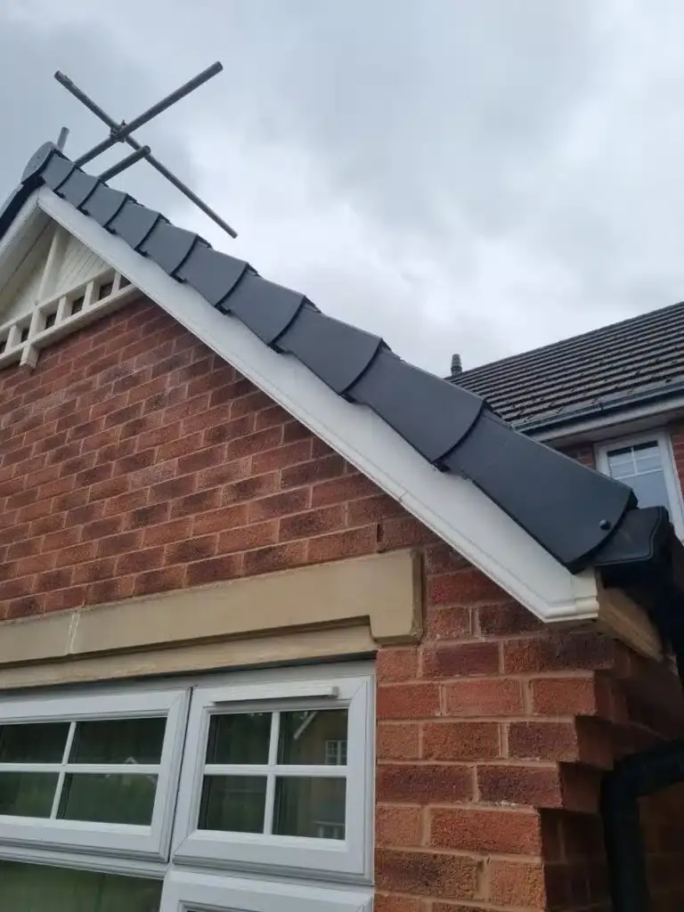 Completed grey dry verge installation on a brick home in Mansfield