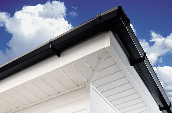 Clean white fascias and soffits with black guttering