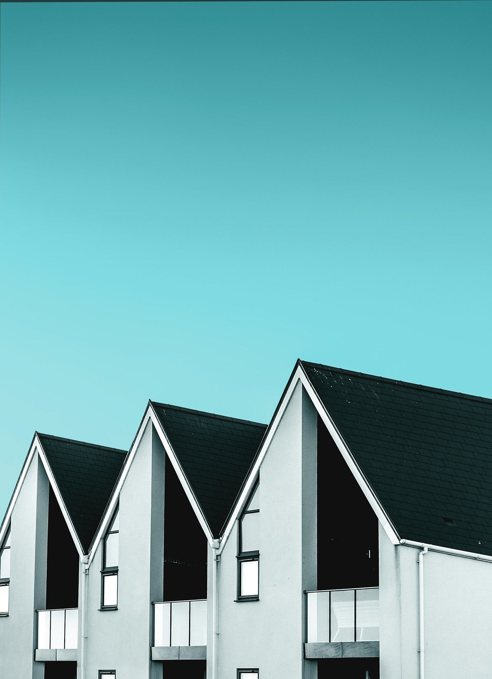Modern house roofline with white fascias and guttering
