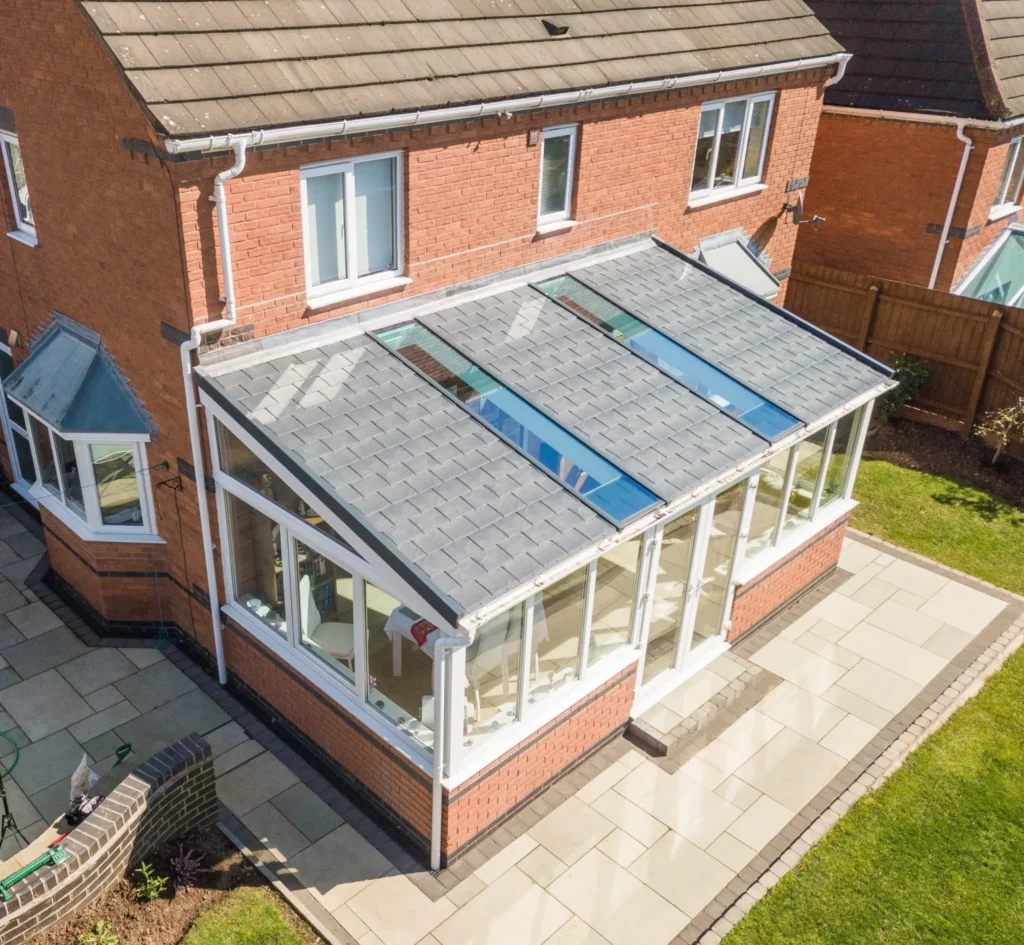 Aerial view of a grey tiled warm roof fitted to a conservatory